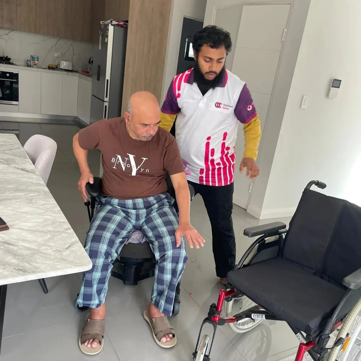 Support worker supporting a participant indoors